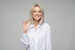 a woman holding a bitcoin