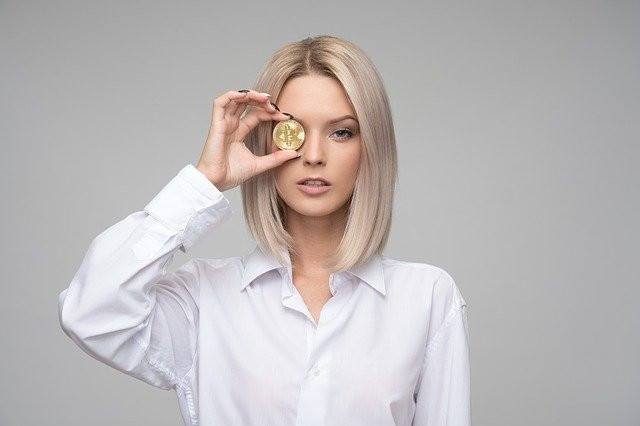 a woman with a coin in her eye