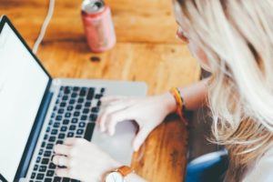 affiliate marketer behind a laptop