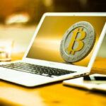 bitcoin on the laptop's screen